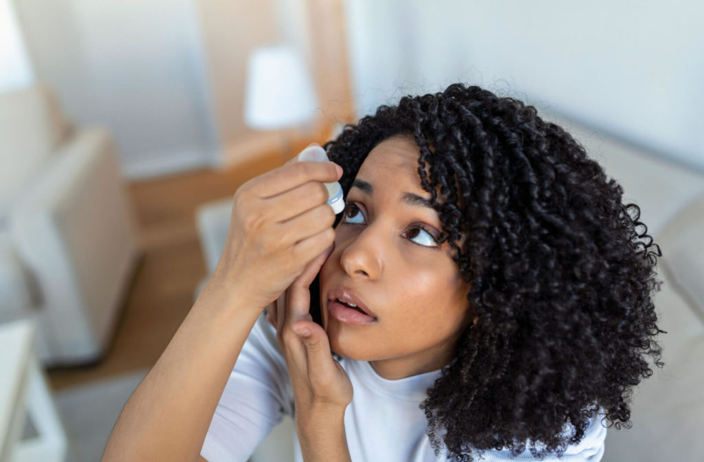 a woman uses eye drops for myopia control