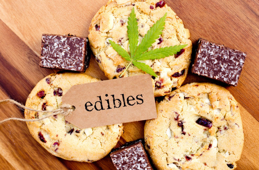 Cookies and coconut brownies with tag that says "edibles" and cannabis leaf.