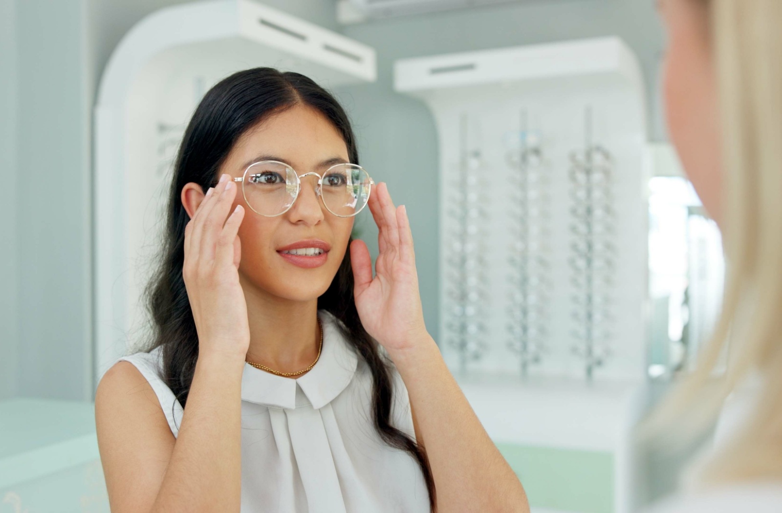 A woman is picking out frames for her new glasses prescription.