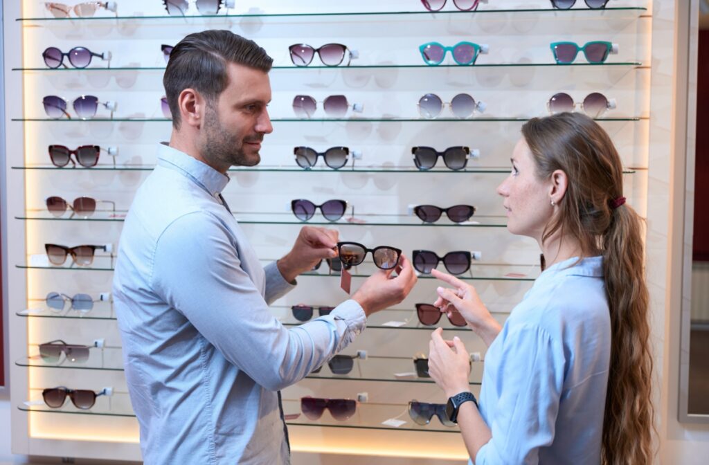 A patient shopping for UV-protective sunglasses to help protect their blue eyes from sunlight.