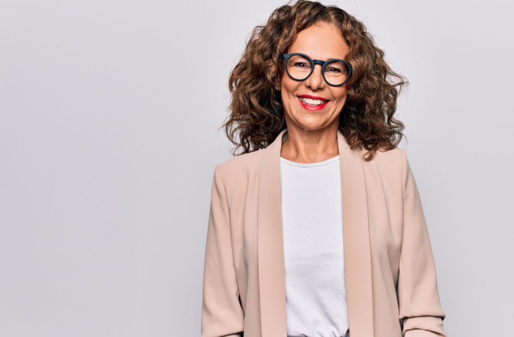 Smiling woman wearing glasses that fit comfortably on her face.